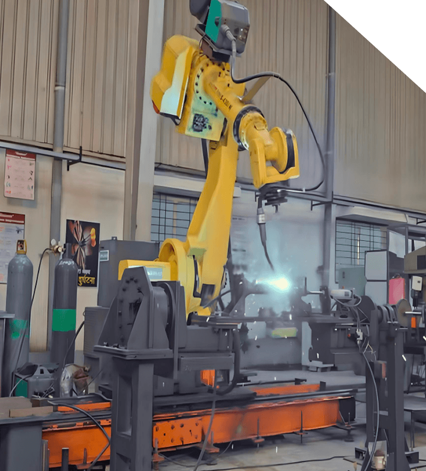 Plant 3, Talegoan MIDC: a robotic welding cell in operation.